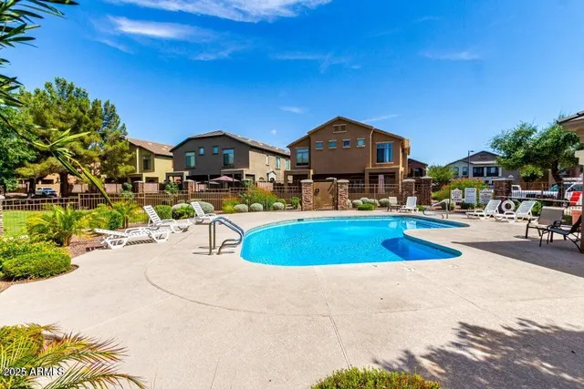 a front view of a house with swimming pool