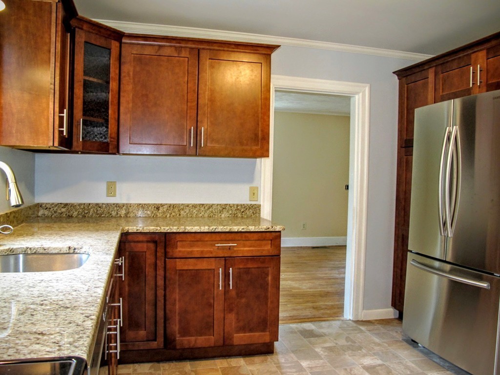 56 Plumtree Road Sunderland, MA 01375 - Photo 11 of 29 a kitchen with a refrigerator and cabinets
