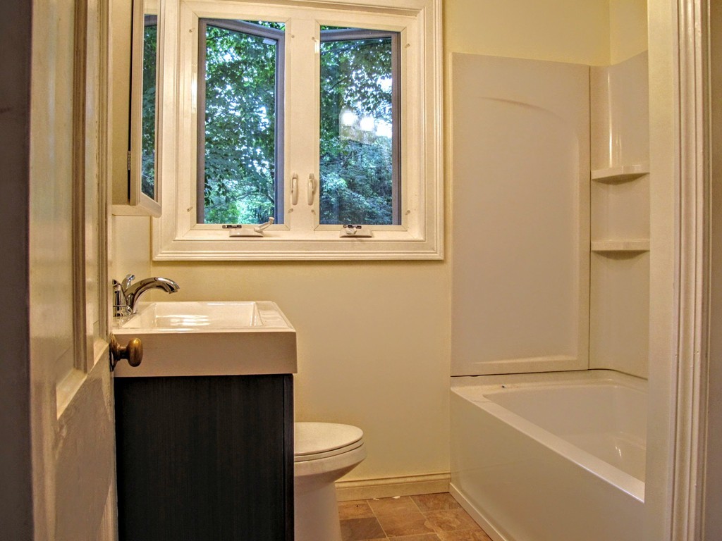 56 Plumtree Road Sunderland, MA 01375 - Photo 18 of 29 a bathroom with a sink a toilet and a bathtub