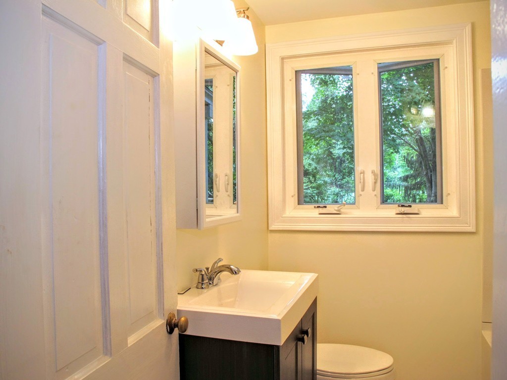 56 Plumtree Road Sunderland, MA 01375 - Photo 19 of 29 a bathroom with a sink vanity mirror and toilet