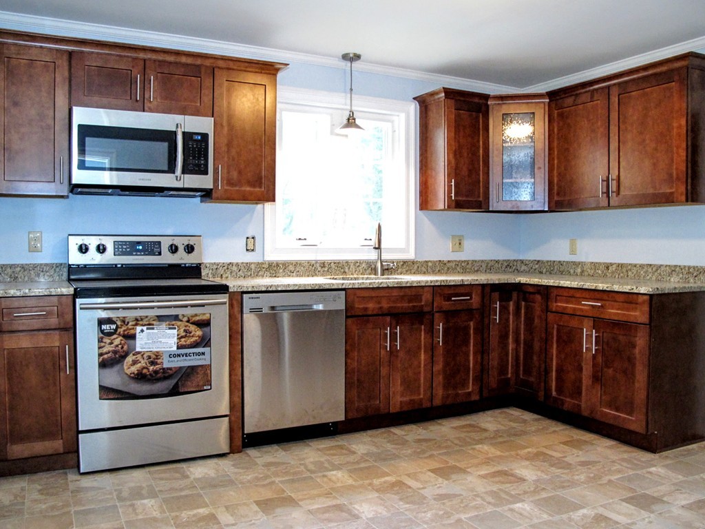 56 Plumtree Road Sunderland, MA 01375 - Photo 8 of 29 a kitchen with stainless steel appliances granite countertop a stove and a microwave
