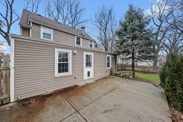 a view of a house with a yard and garage