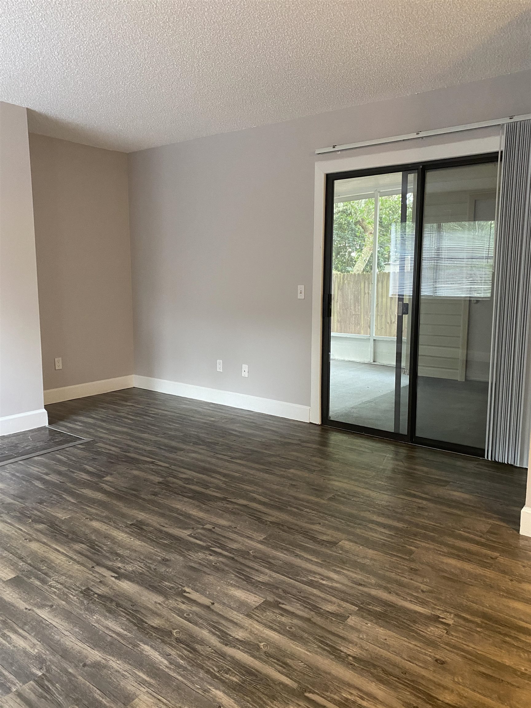 35 Atlantic Oaks Circle, Unit A St. Augustine Beach, FL 32080 - Photo 21 of 21 a view of an empty room with wooden floor and a window