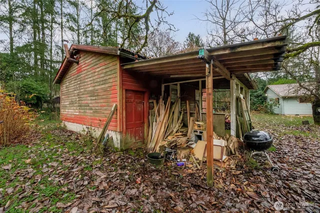 a view of a tiny house with a yard