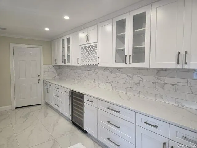 a view of kitchen with cabinets