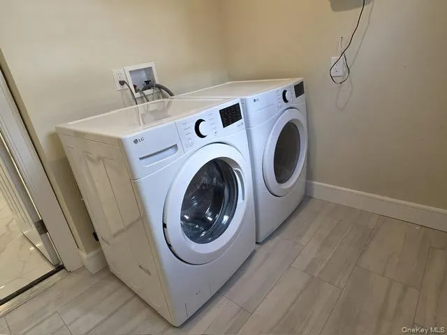 a utility room with dryer and washer