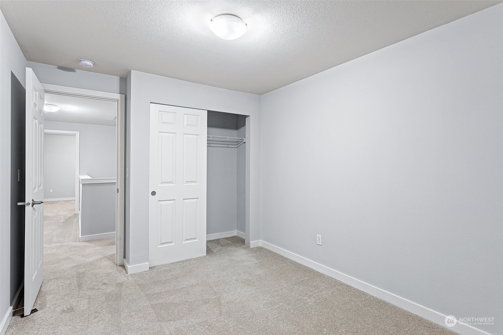 18930 Bothell Everett Highway, Unit L102 Bothell, WA 98012 - Photo 15 of 28 an empty room with closet area
