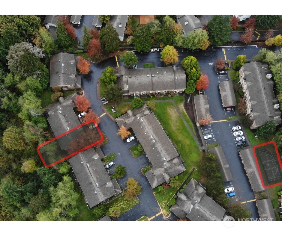 18930 Bothell Everett Highway, Unit L102 Bothell, WA 98012 - Photo 28 of 28 an aerial view of multiple houses with yard