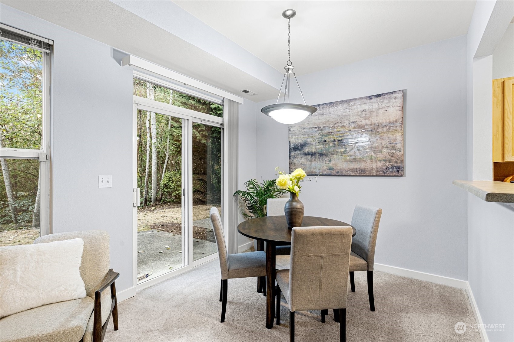 18930 Bothell Everett Highway, Unit L102 Bothell, WA 98012 - Photo 8 of 28 a view of a dining room with furniture window and outside view