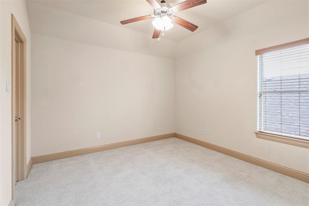 437 Middleton Drive Roanoke, TX 76262 - Photo 32 of 40 Largest secondary bedroom located upstairs, featuring a full bath and access to the bonus room.