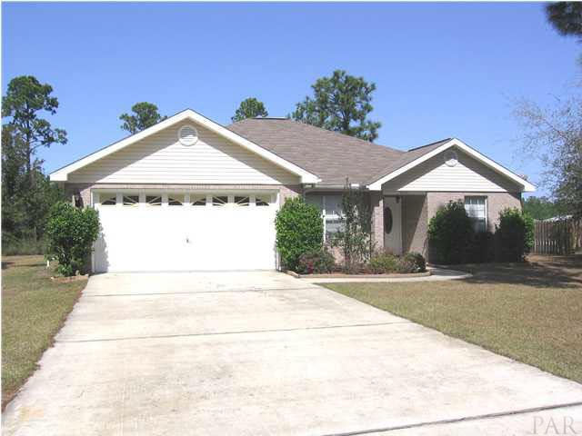 7346 Treasure Street Navarre, FL 32566 - Photo 1 of 14 Another front view of the home.