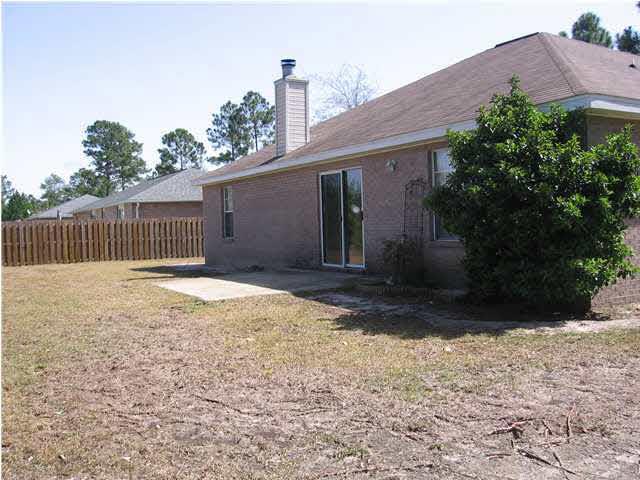 7346 Treasure Street Navarre, FL 32566 - Photo 2 of 14 Back of home w/open yard