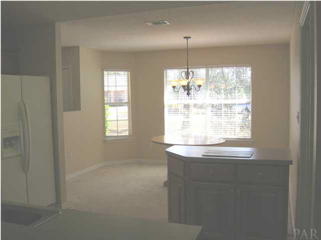 7346 Treasure Street Navarre, FL 32566 - Photo 5 of 14 Looking from kitchen into the spacious & bright dining room.