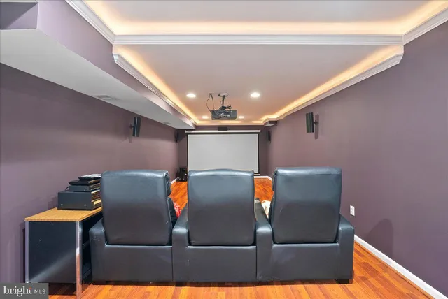 a view of a room with a sink and wooden floor