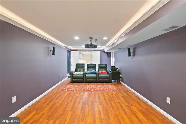 a view of a kitchen with wooden floor