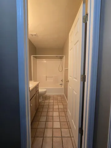 a bathroom with a glass door shower