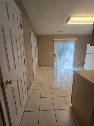 a view of empty room with a fireplace