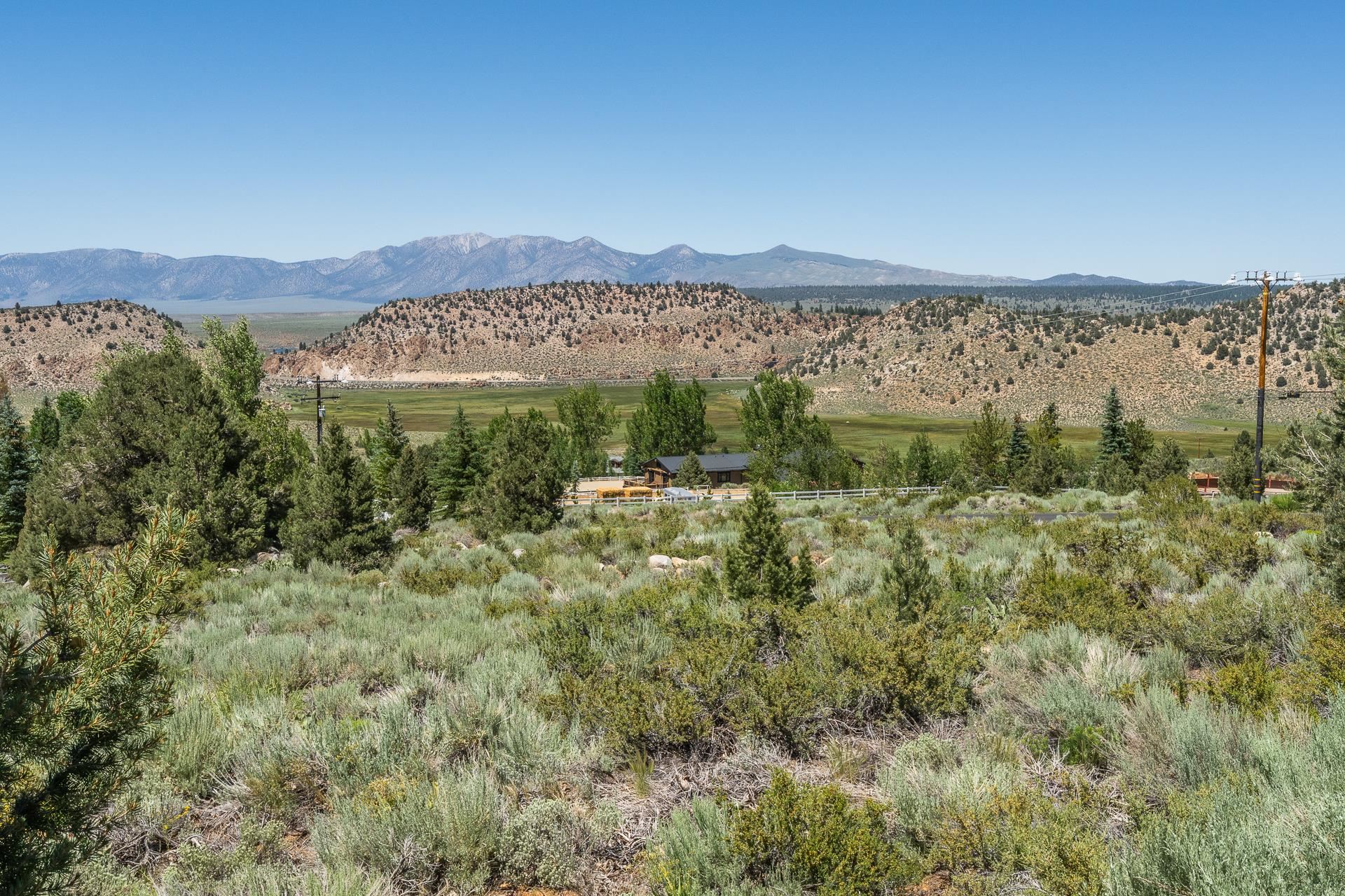 537 Aspen Spring Ranch Road Mammoth Lakes, CA 93546 - Photo 35 of 40 Expansive natural landscape featuring rolling hills and distant mountains