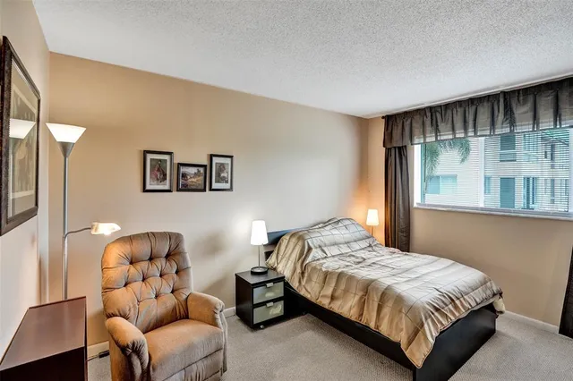 a bedroom with a bed and couch