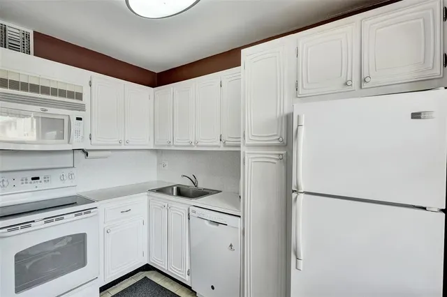 a bedroom with a bed and couch