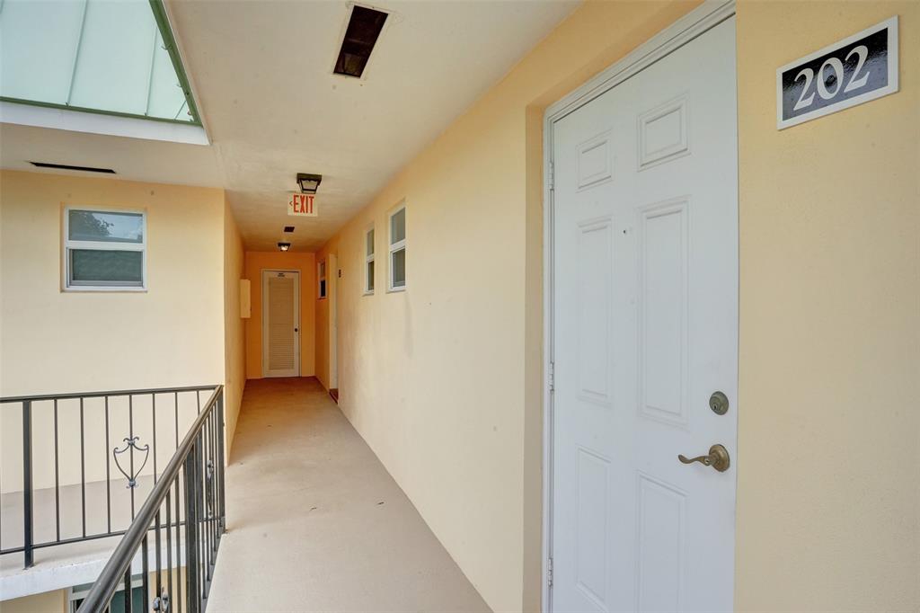 32 Colonial Club Drive, Unit 202 Boynton Beach, FL 33435 - Photo 28 of 38 a view of a hallway