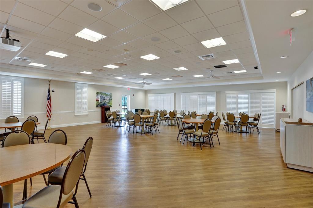 32 Colonial Club Drive, Unit 202 Boynton Beach, FL 33435 - Photo 36 of 38 a view of a dining room with furniture and chandelier