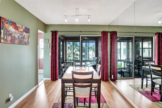 a kitchen with stainless steel appliances granite countertop a refrigerator sink and cabinets