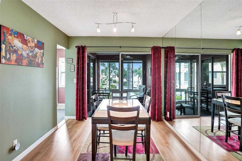 32 Colonial Club Drive, Unit 202 Boynton Beach, FL 33435 - Photo 8 of 38 a dining room with furniture and window