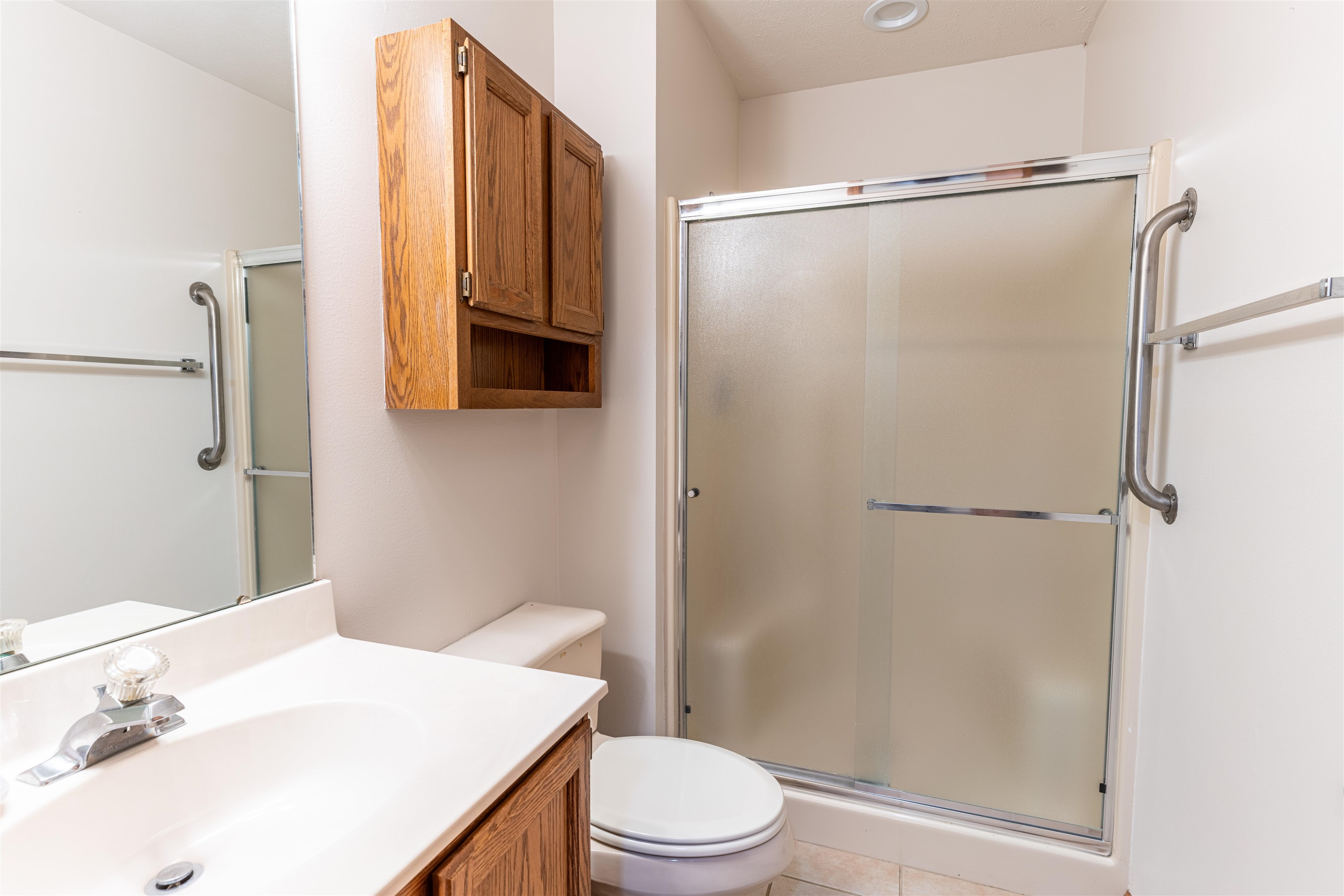 5269 Windsor Road Loves Park, IL 61111 - Photo 16 of 32 a bathroom with a sink vanity mirror and toilet