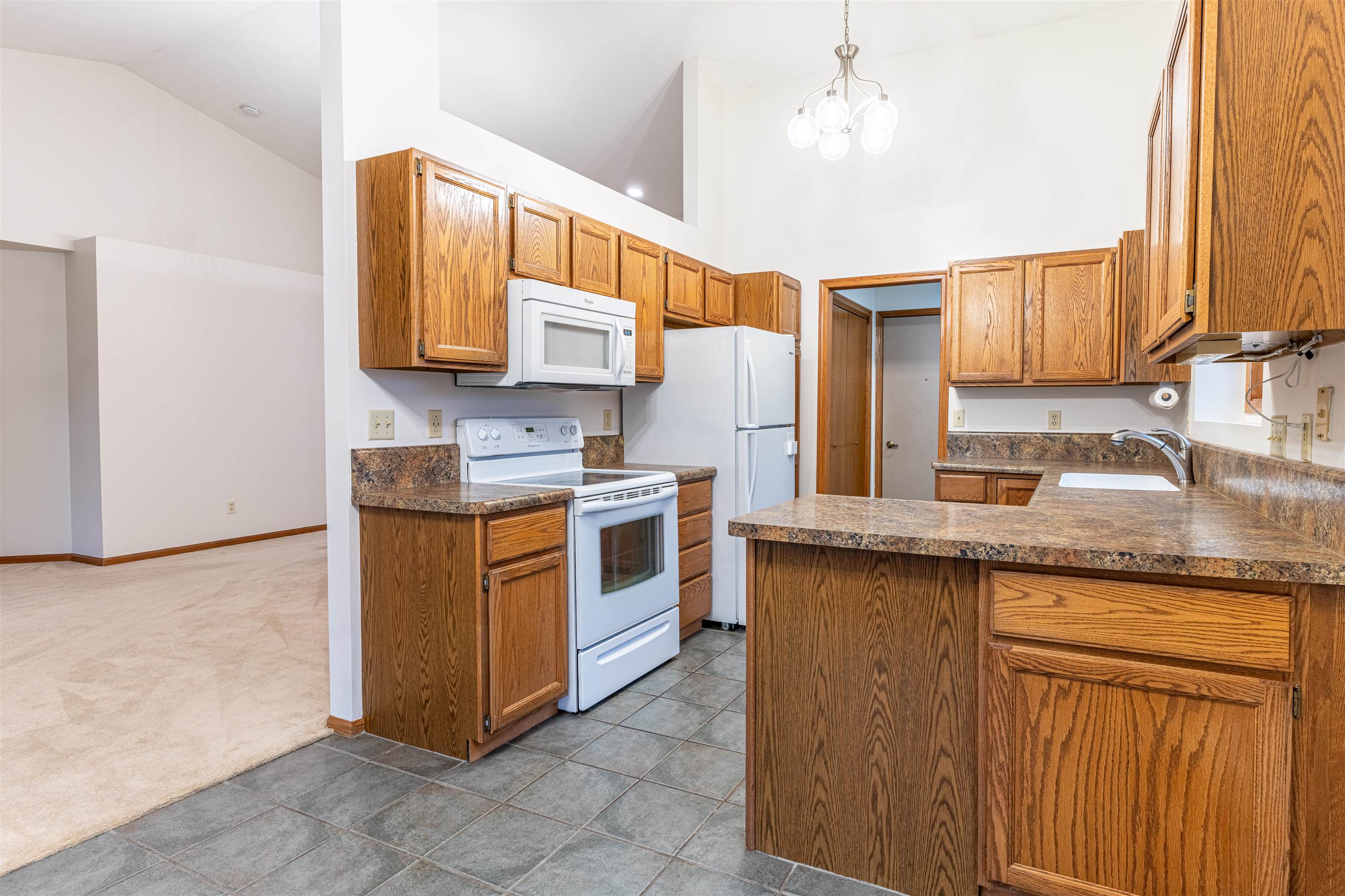 5269 Windsor Road Loves Park, IL 61111 - Photo 25 of 32 a kitchen with stainless steel appliances granite countertop a sink and cabinets