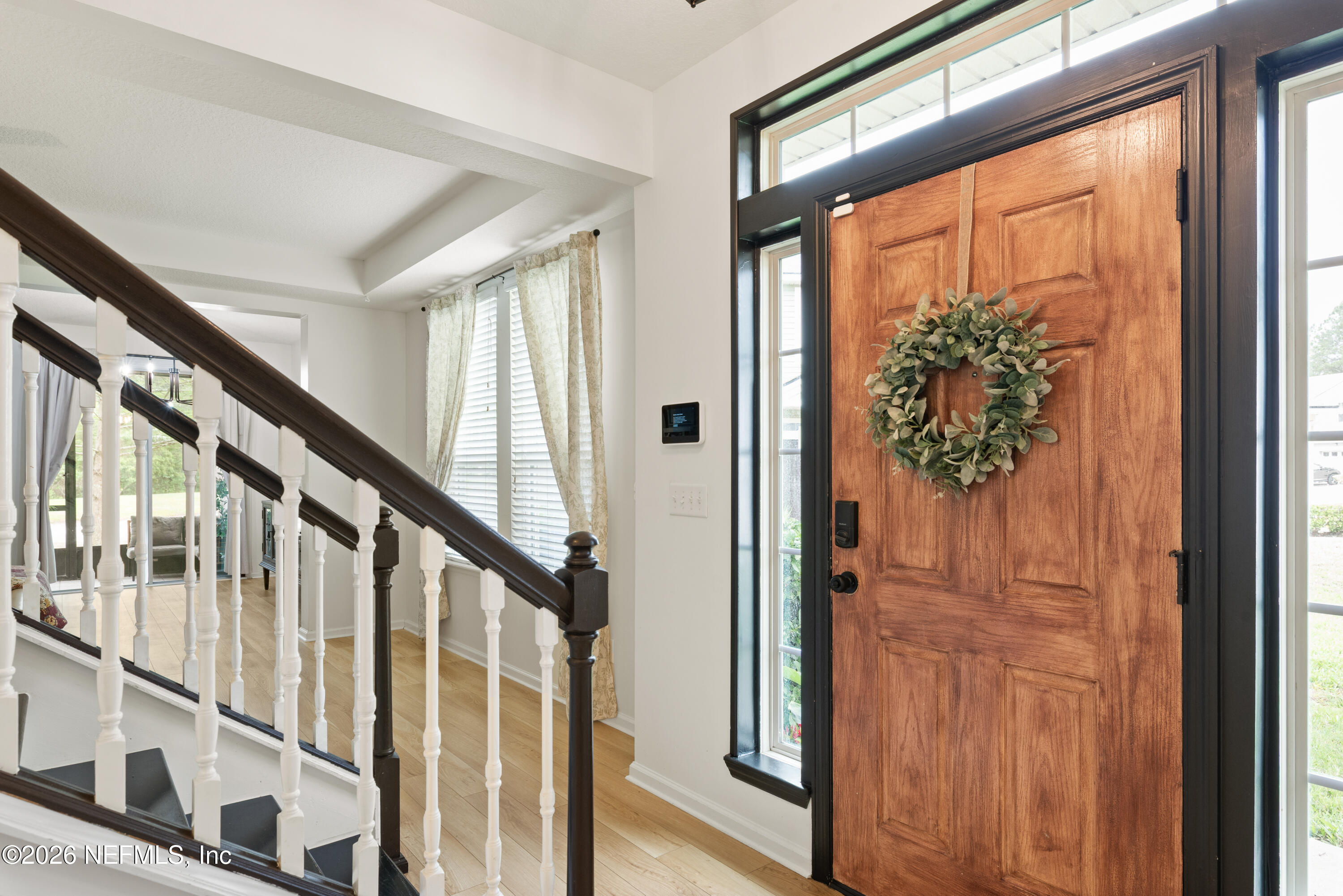 111 Paradas Place St. Augustine, FL 32092 - Photo 17 of 46 a view of an entryway with wooden floor and windows