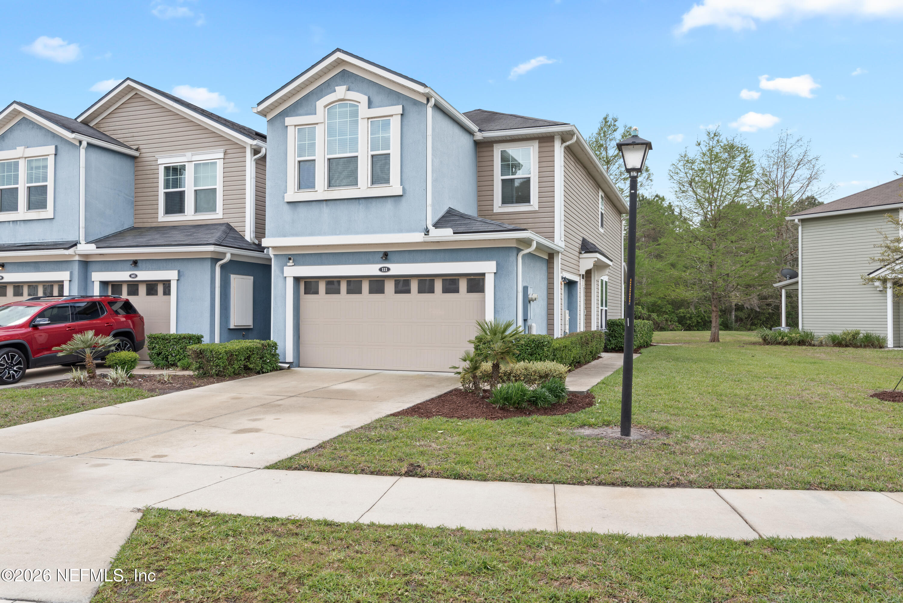 111 Paradas Place St. Augustine, FL 32092 - Photo 2 of 46 a front view of a house with a yard