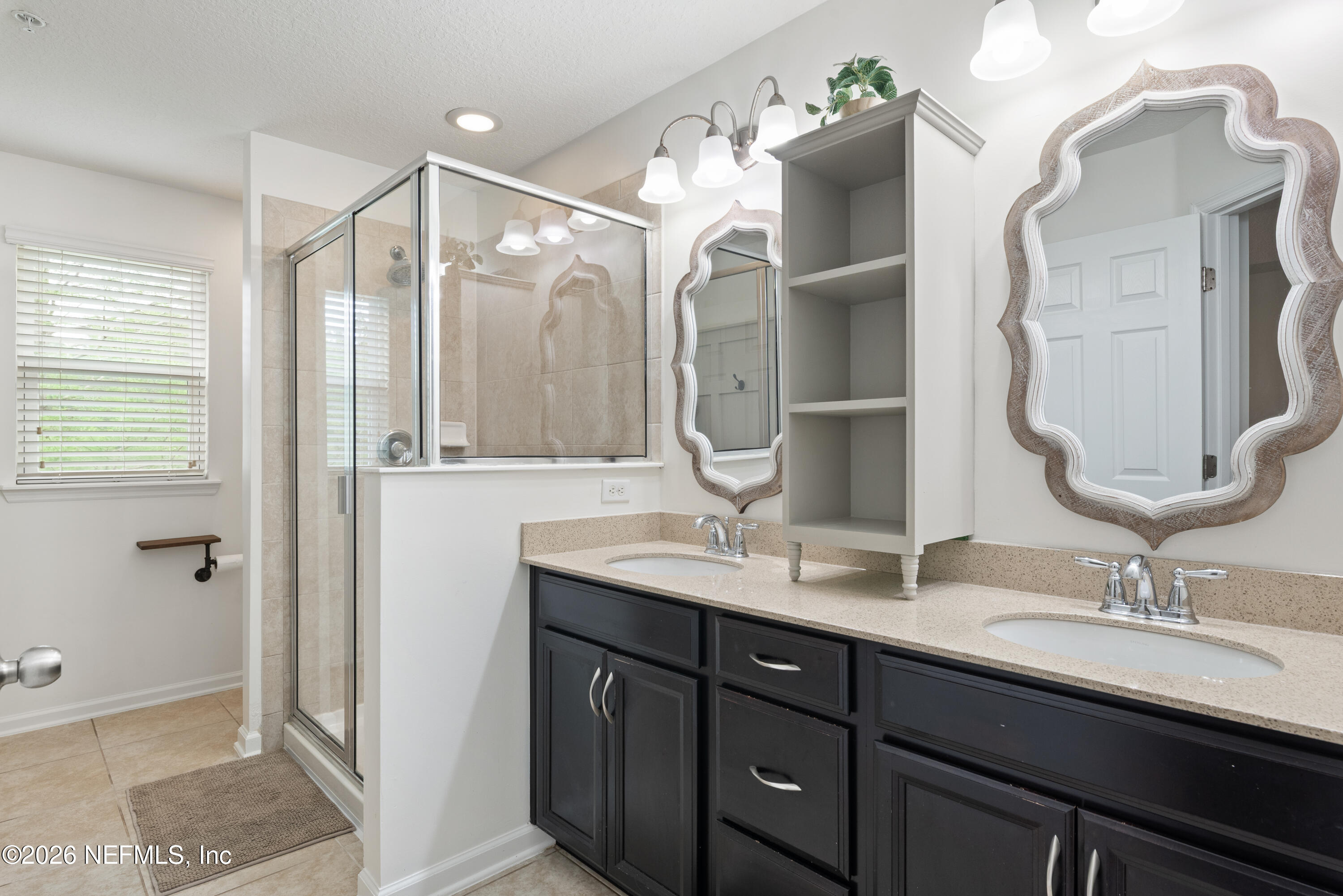 111 Paradas Place St. Augustine, FL 32092 - Photo 26 of 46 a bathroom with a double vanity sink mirror and double
