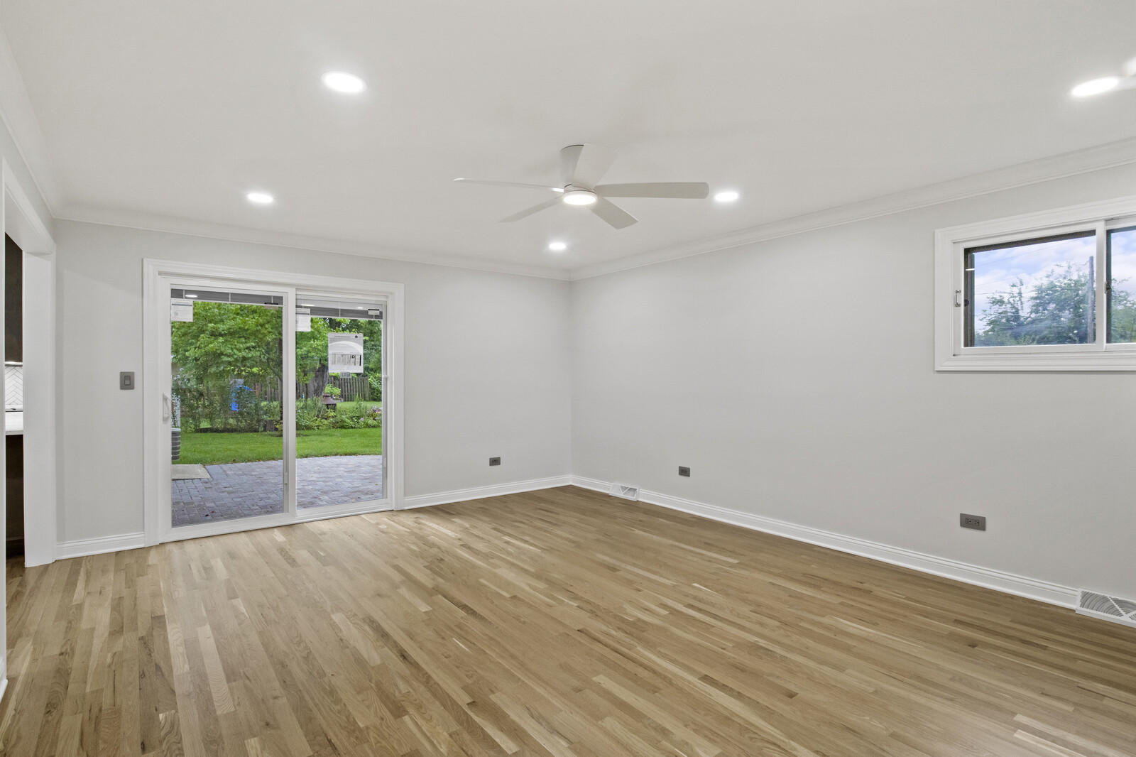 580 Geronimo Street Hoffman Estates, IL 60169 - Photo 11 of 28 wooden floor in an empty room with a window