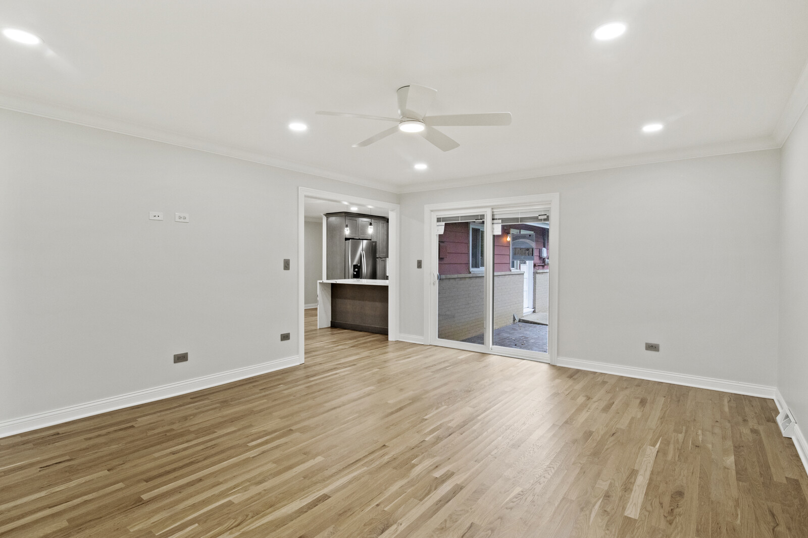 580 Geronimo Street Hoffman Estates, IL 60169 - Photo 12 of 28 an empty room with wooden floor and windows