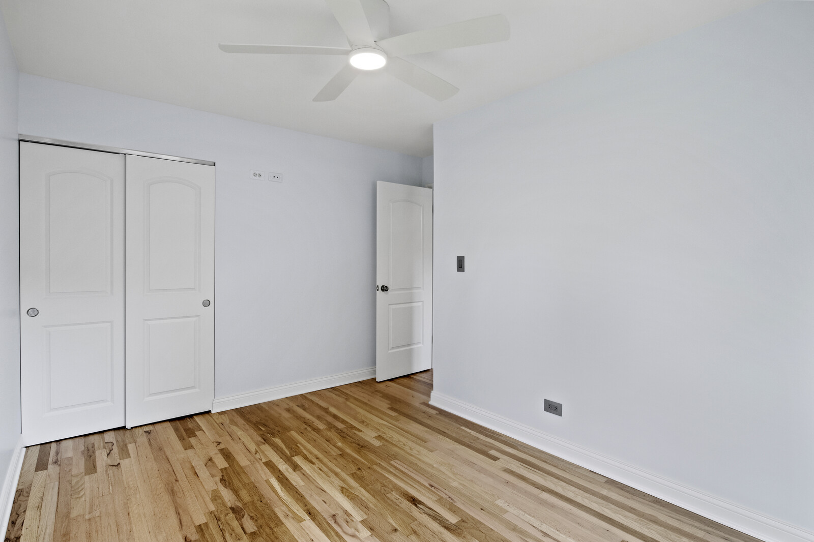 580 Geronimo Street Hoffman Estates, IL 60169 - Photo 16 of 28 a view of a room with wooden floor and fan