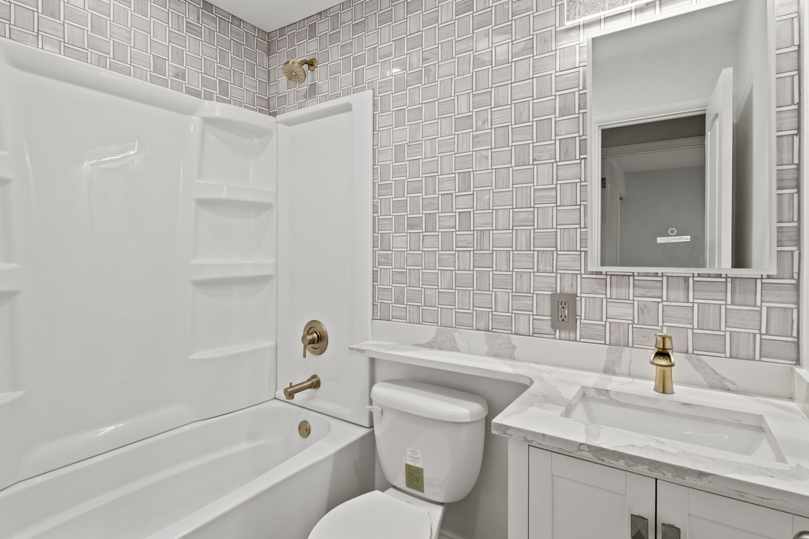 580 Geronimo Street Hoffman Estates, IL 60169 - Photo 17 of 28 a bathroom with a granite countertop sink a toilet and bathtub