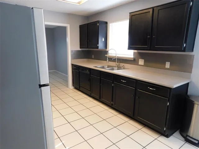 a kitchen with a sink and a microwave