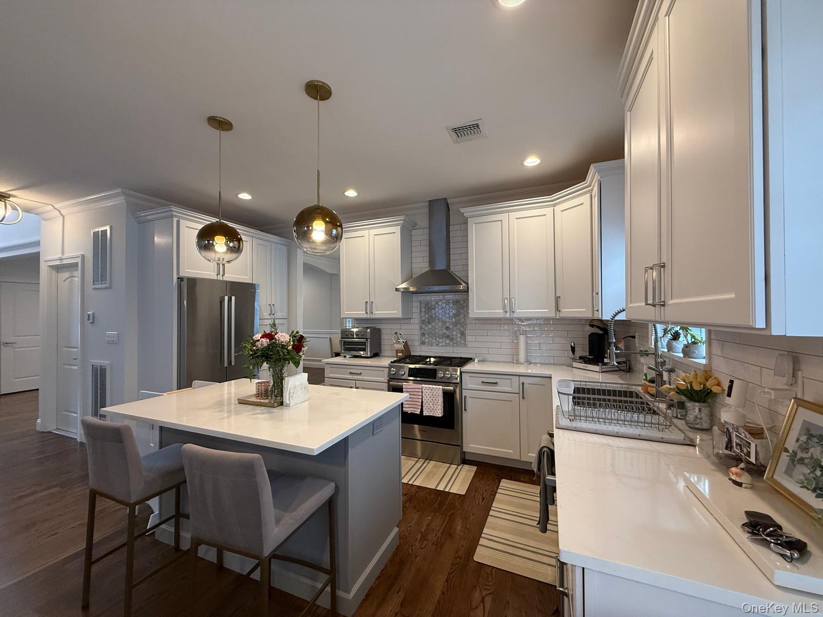 116 Winifred Drive Merrick, NY 11566 - Photo 14 of 40 a kitchen with a sink stove and cabinets