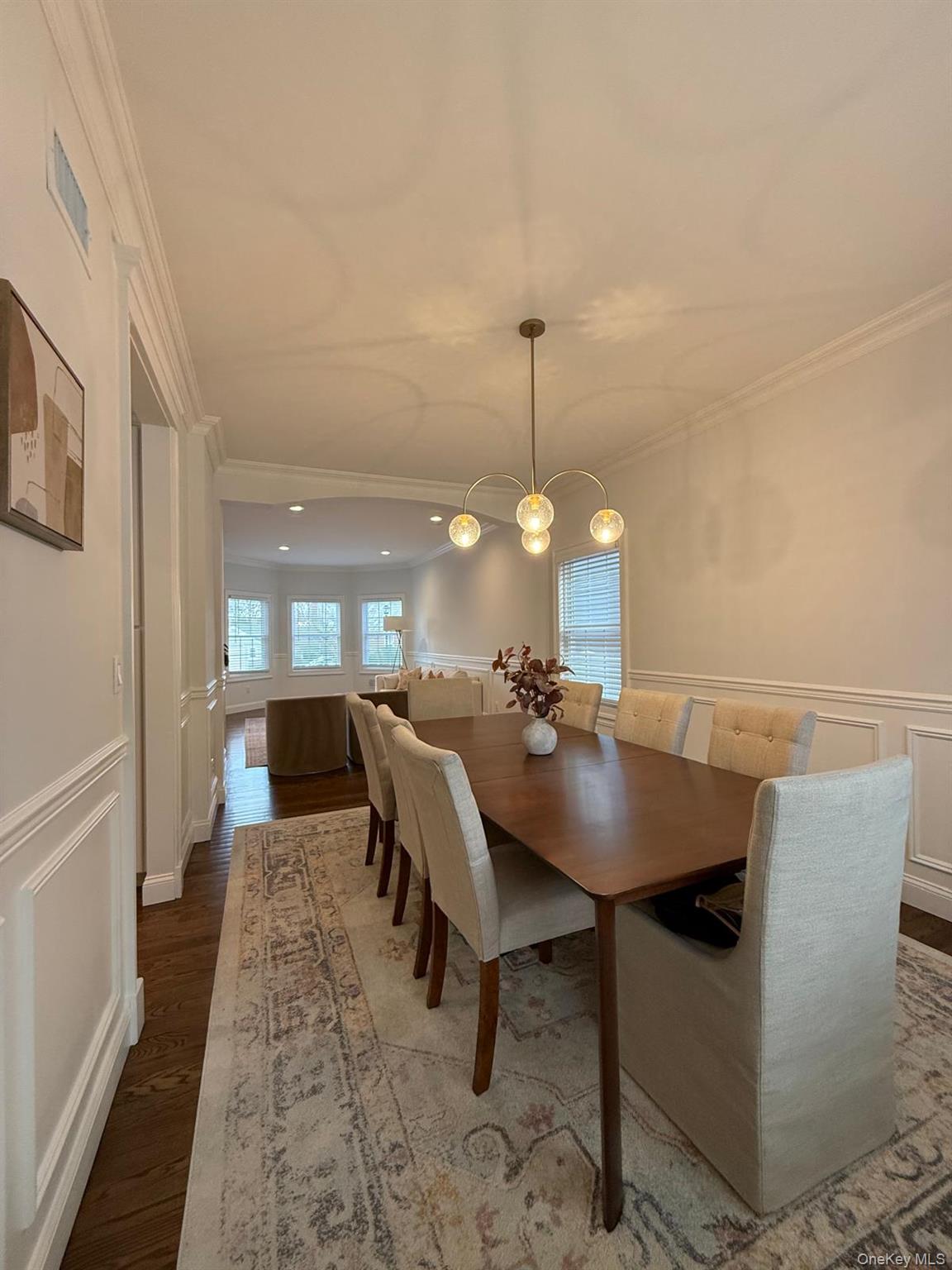 116 Winifred Drive Merrick, NY 11566 - Photo 16 of 40 a view of a dining room and a table and chairs