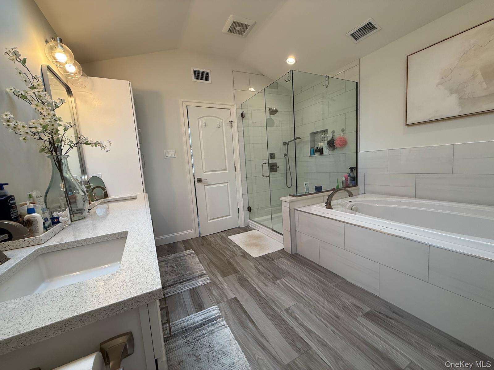 116 Winifred Drive Merrick, NY 11566 - Photo 25 of 40 a bathroom with a tub sink and mirror