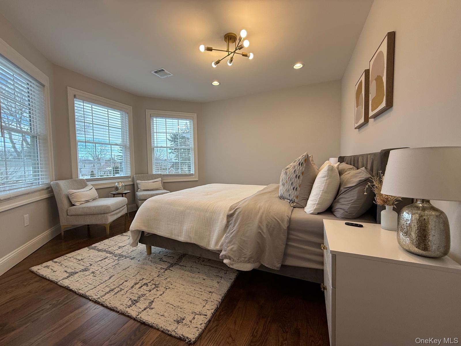 116 Winifred Drive Merrick, NY 11566 - Photo 29 of 40 a bed sitting in a bedroom next to a window