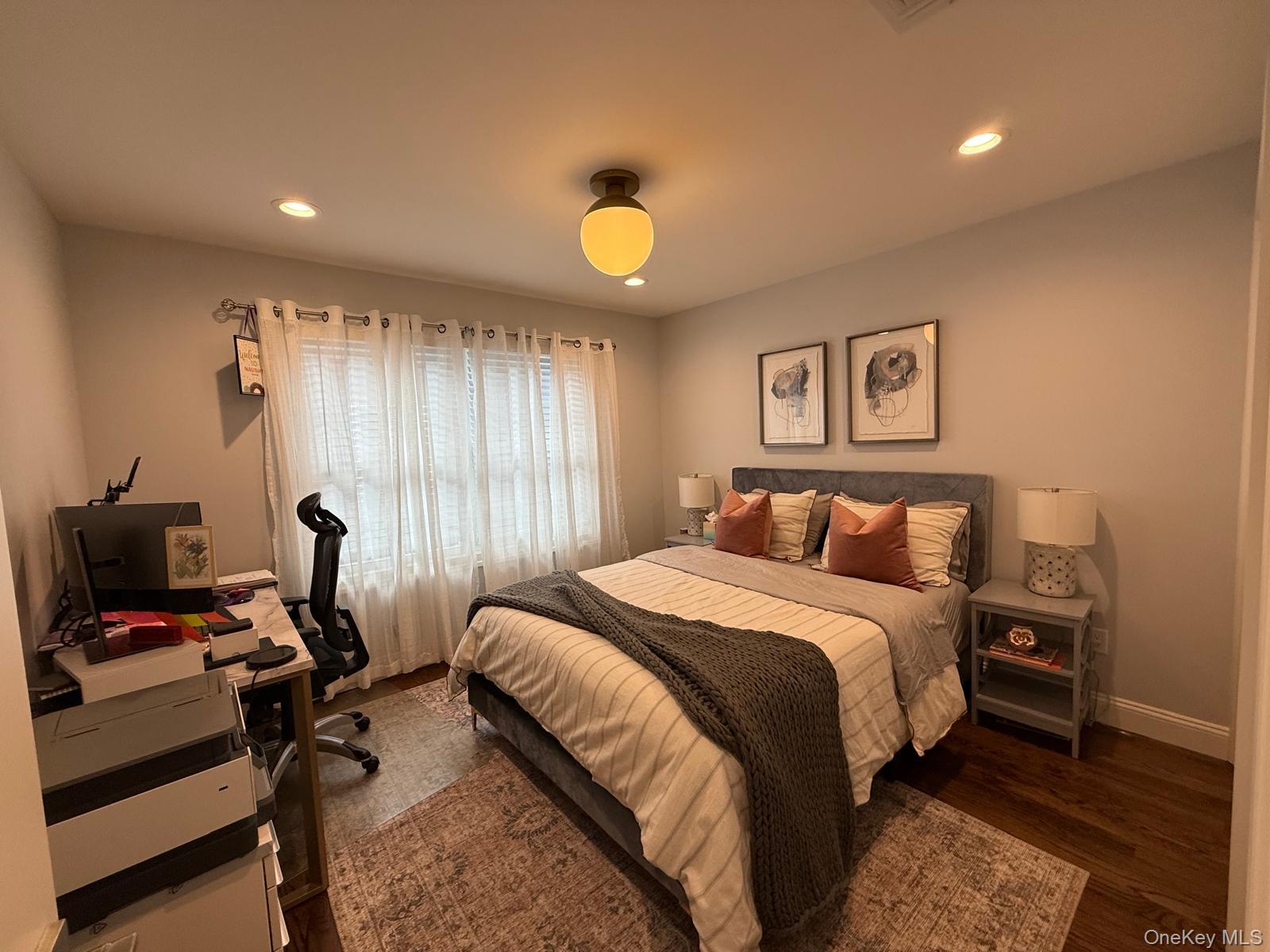 116 Winifred Drive Merrick, NY 11566 - Photo 30 of 40 a bedroom with a bed and a desk