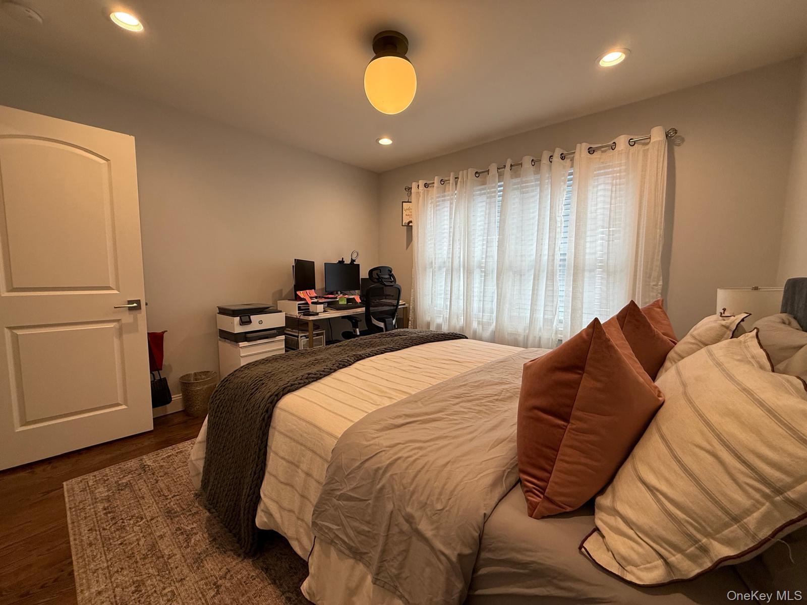 116 Winifred Drive Merrick, NY 11566 - Photo 31 of 40 a bedroom with a bed and window