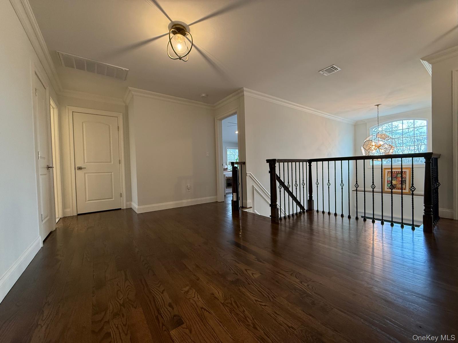 116 Winifred Drive Merrick, NY 11566 - Photo 32 of 40 a view of staircase with wooden floor and fan