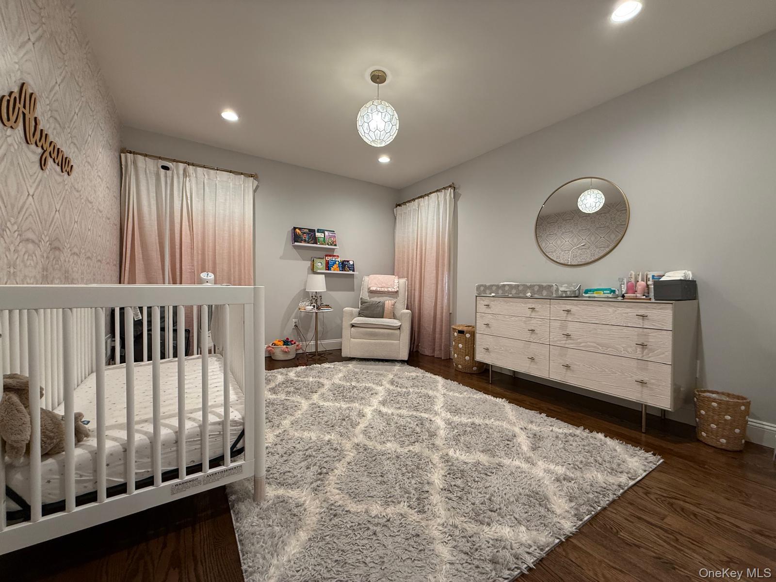 116 Winifred Drive Merrick, NY 11566 - Photo 34 of 40 a view of a bedroom with furniture and window