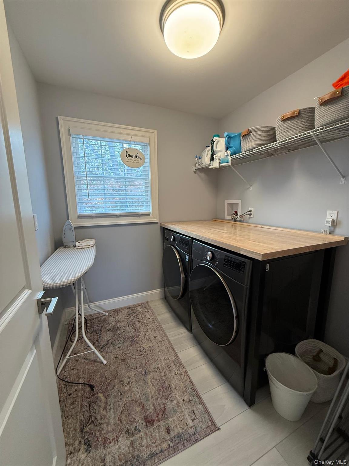 116 Winifred Drive Merrick, NY 11566 - Photo 35 of 40 a room with a washing machine and a chair