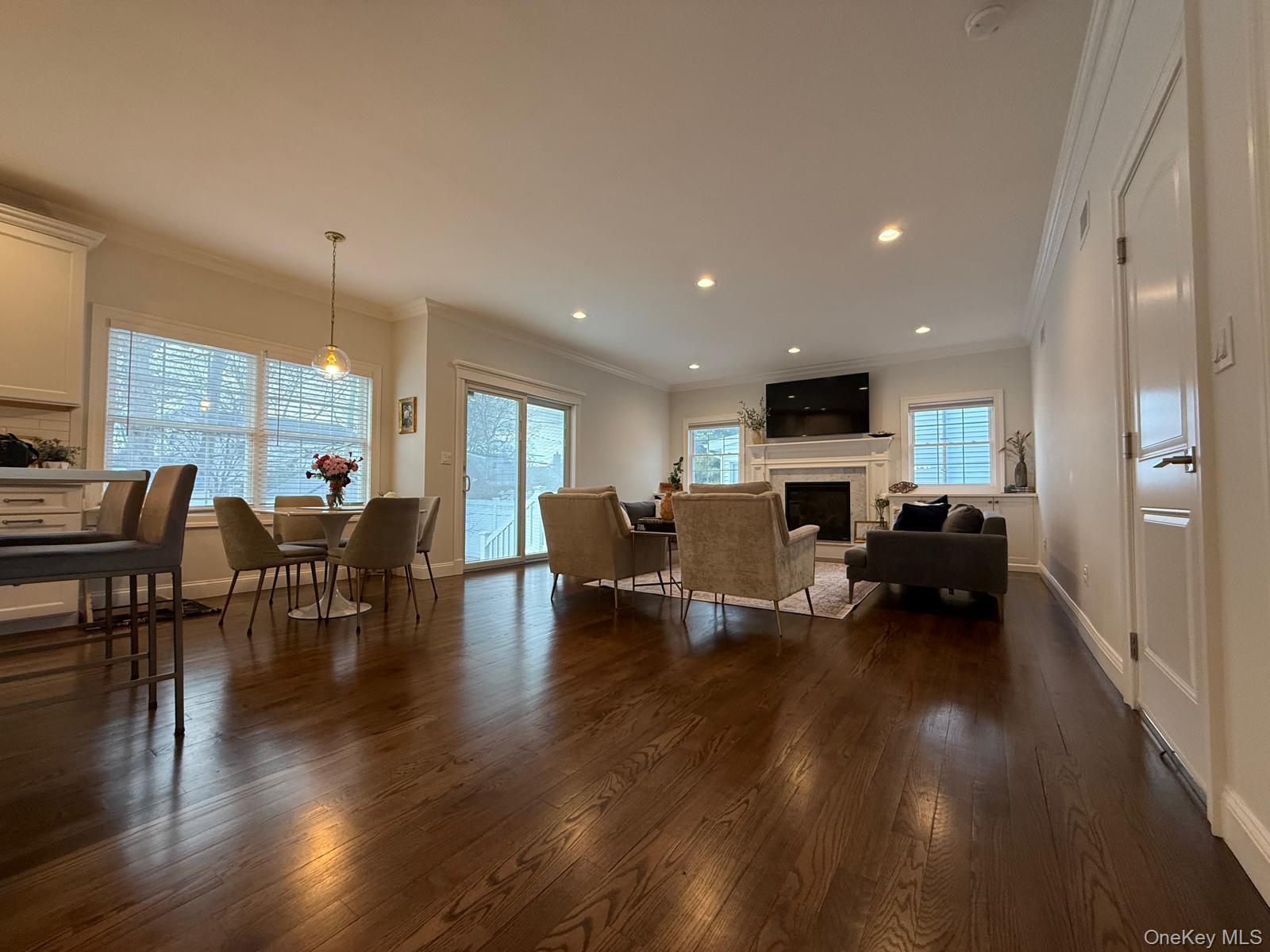 116 Winifred Drive Merrick, NY 11566 - Photo 8 of 40 a living room with furniture and a flat screen tv