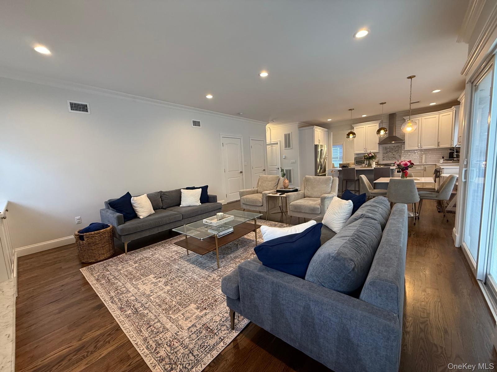 116 Winifred Drive Merrick, NY 11566 - Photo 10 of 40 a living room with furniture and a rug