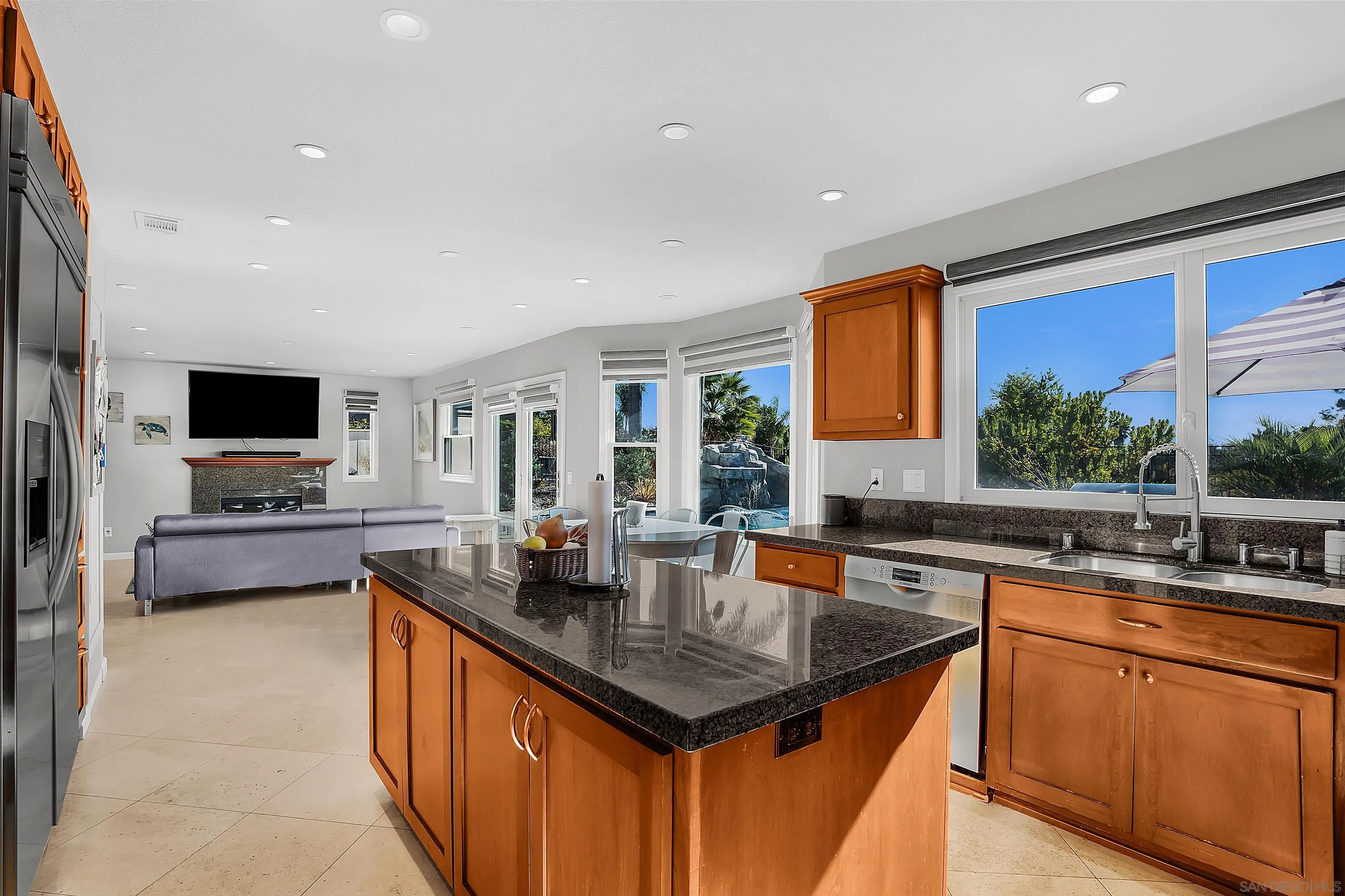 2653 Sausalito Avenue Carlsbad, CA 92010 - Photo 5 of 30 a kitchen with stainless steel appliances granite countertop a sink and a stove